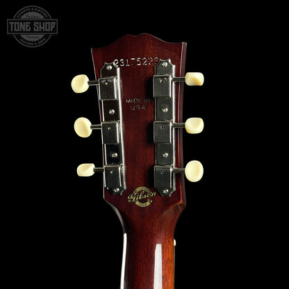 Gibson guitar headstock with brand logo on a black background