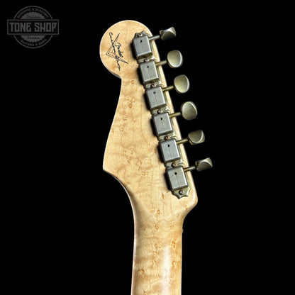 Guitar headstock with tuning pegs on a black background, featuring the Tone Shop logo.