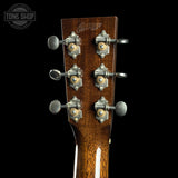 Guitar headstock with tuning pegs on a black background, featuring the Collings logo.