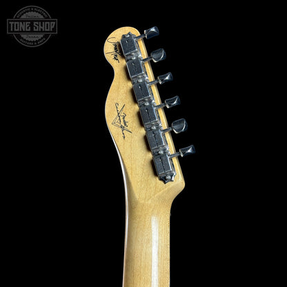 Guitar headstock with tuning pegs on a black background, featuring the Tone Shop logo.