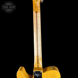 Close-up of a guitar neck and headstock on a black background with 'Tone Shop' branding.