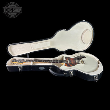 Guitar in a case with 'Tone Shop' logo in the corner