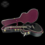 Guitar in an open case with 'Tone Shop' logo in the corner