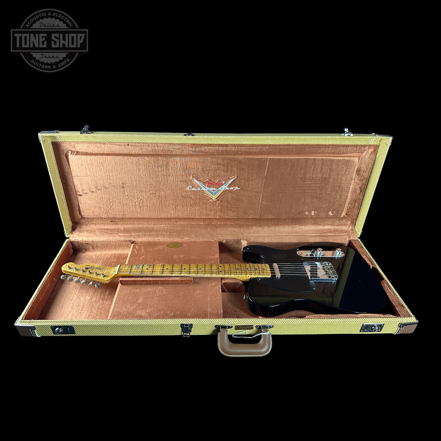 Guitar in a case with a visible brand logo on a black background