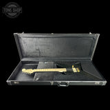 Black guitar case with a gold electric guitar inside, on a black background with 'Tone Shop' logo.