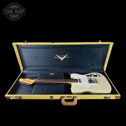 Guitar in a case with a visible brand logo on a black background