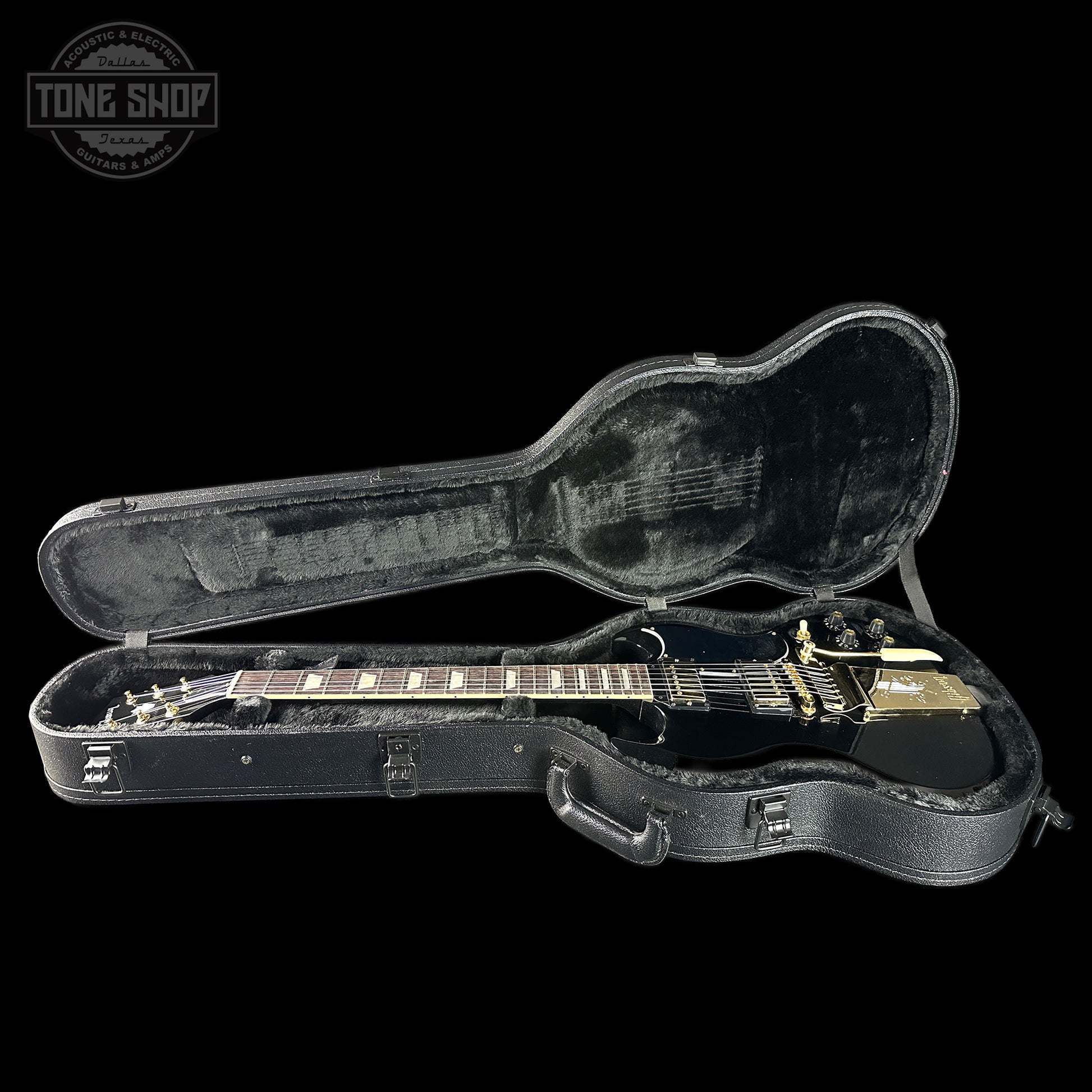 Guitar in a black case with 'Tone Shop' logo in the corner