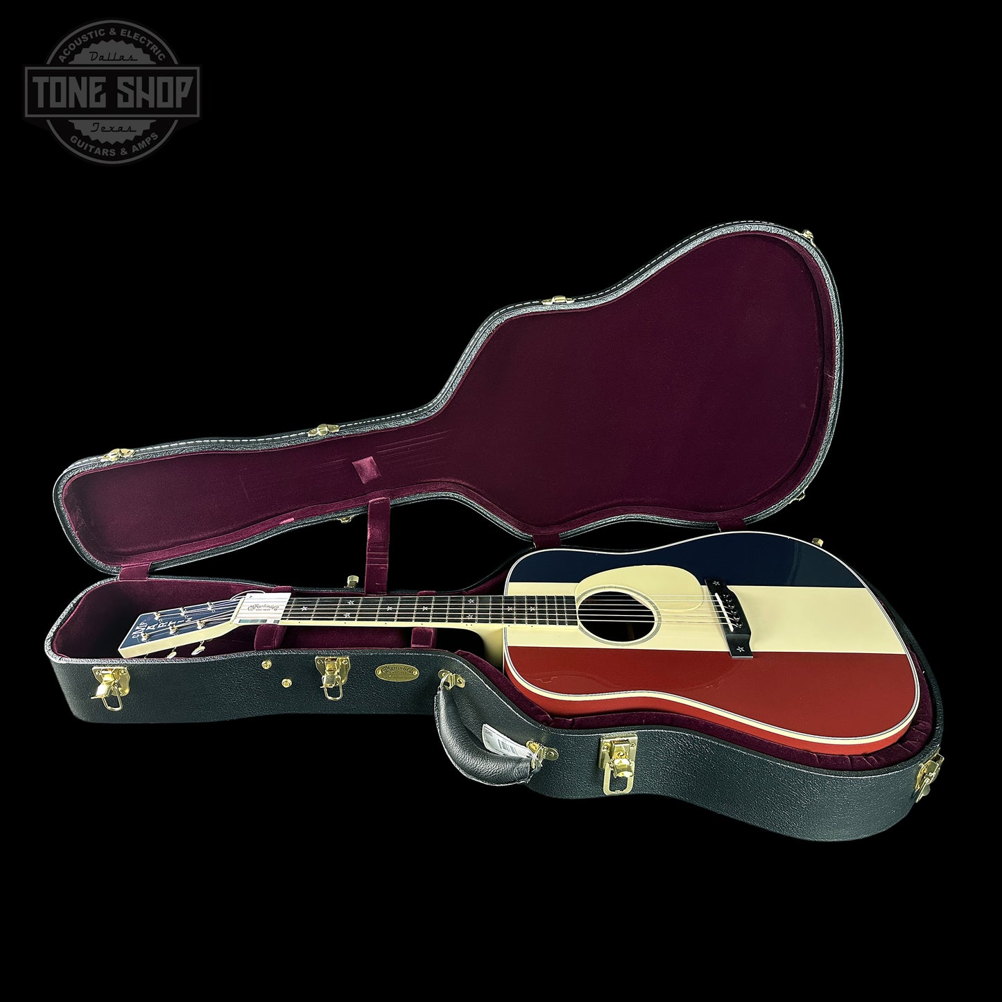 Guitar in a case with 'Tone Shop' logo in the corner