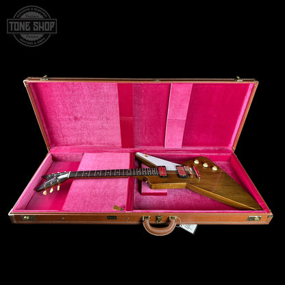 Guitar in a pink case with 'Tone Shop' logo in the corner