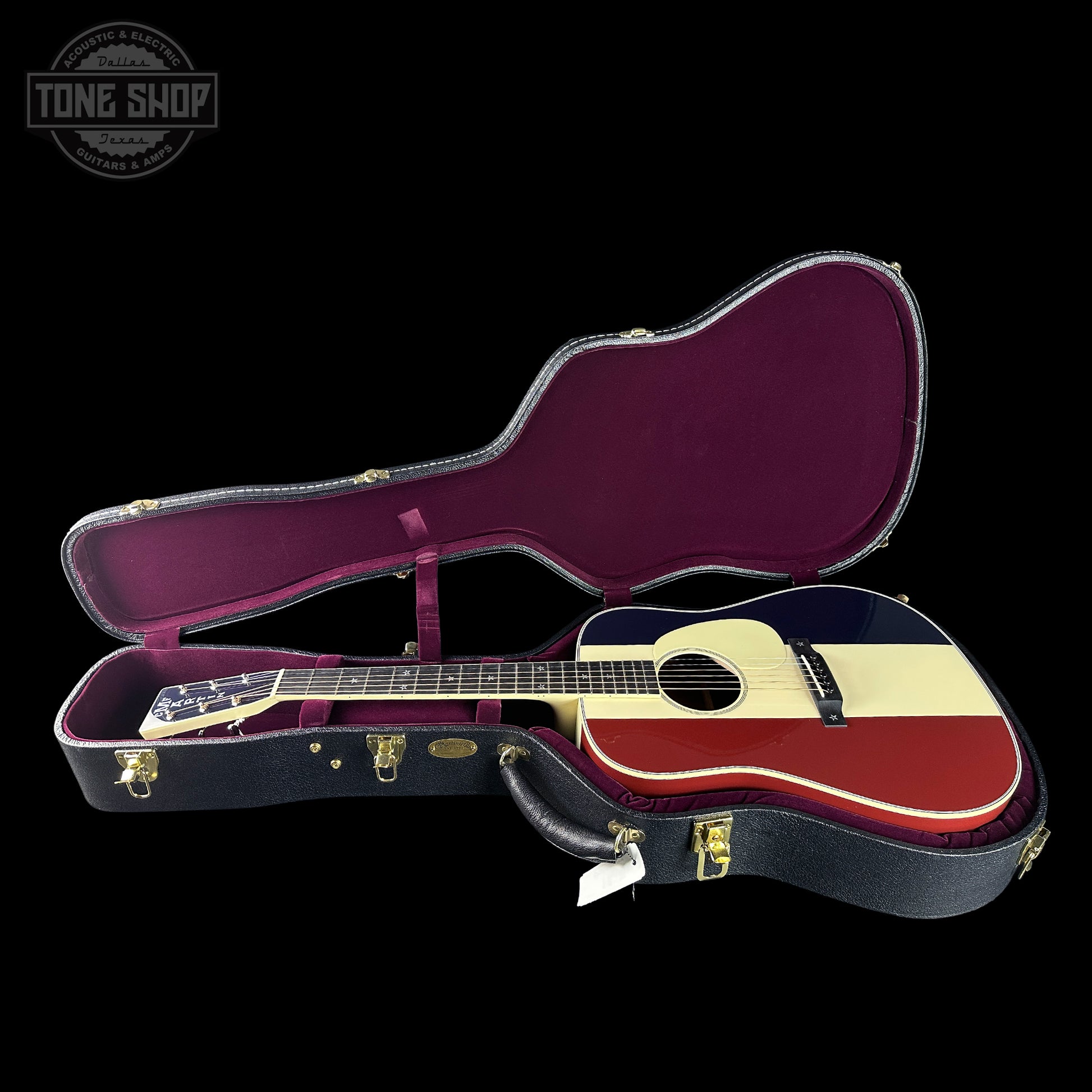 Guitar in a case with 'Tone Shop' logo in the corner