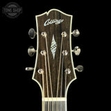 Front of headstock of Collings SJ Custom Jet Black Top Tigerstripe Pickguard Old Growth Sitka/Bastogne Walnut.