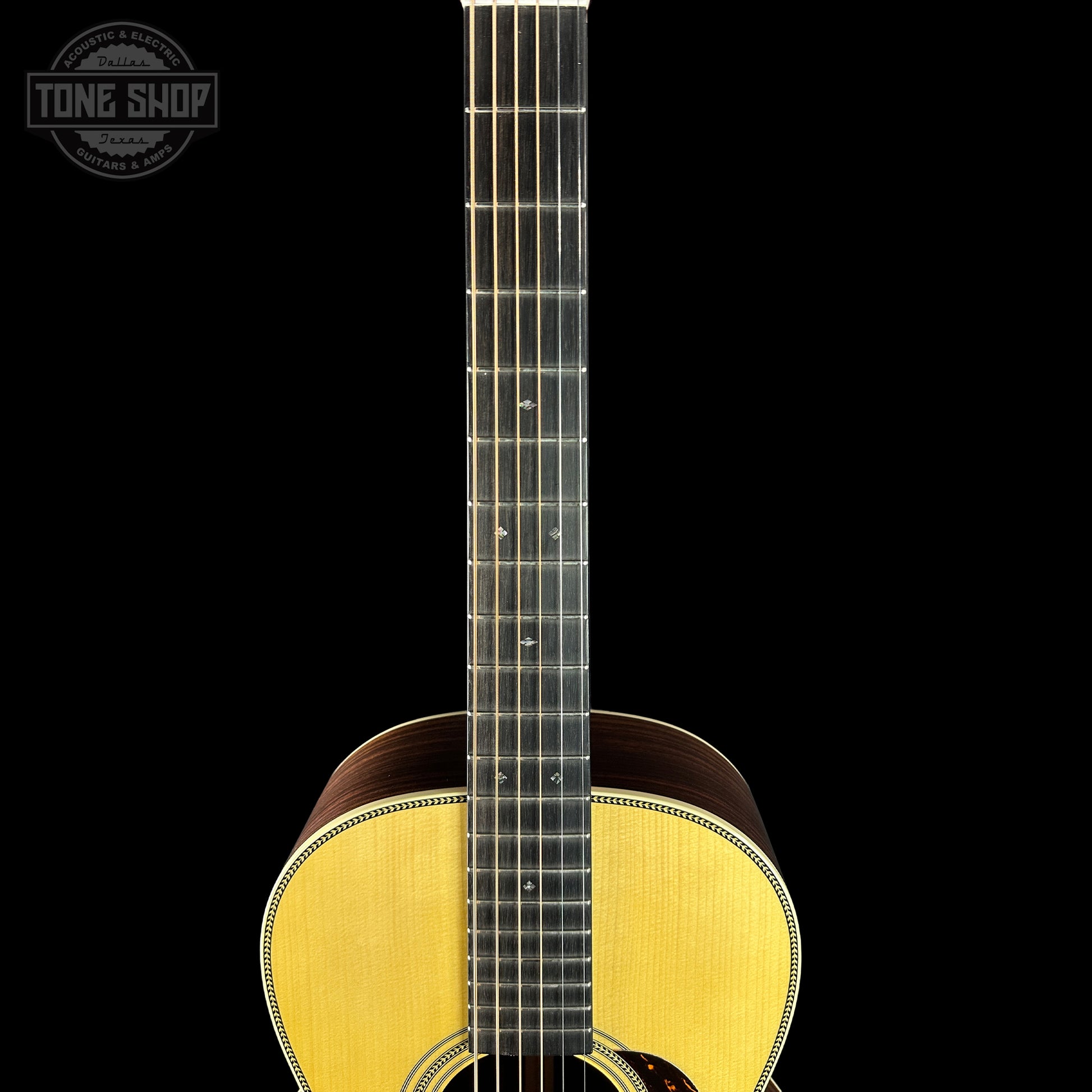 Fretboard of Martin Custom Shop 00-12 Fret Wild Grain East Indian Rosewood.