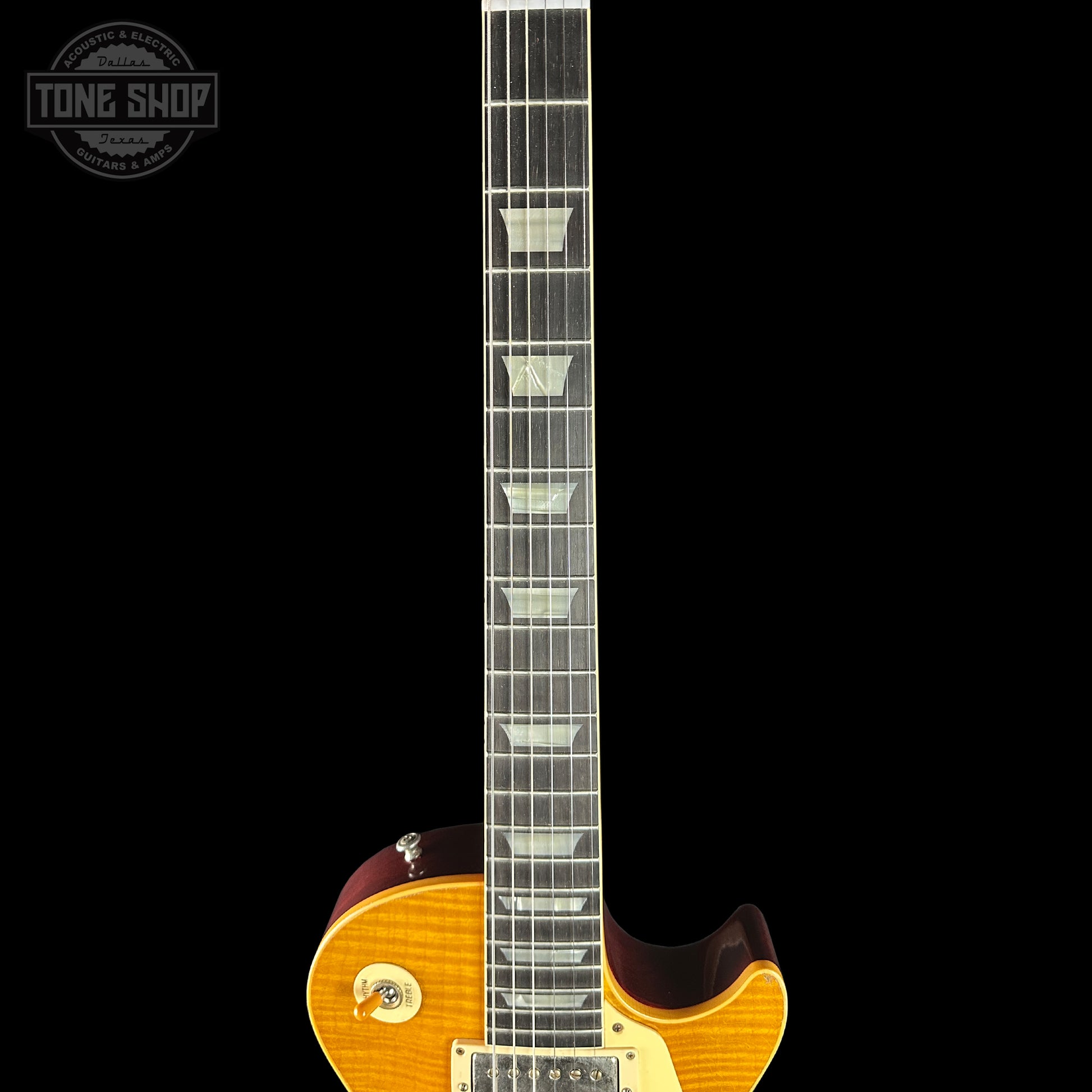 Electric guitar with a visible brand logo on a black background