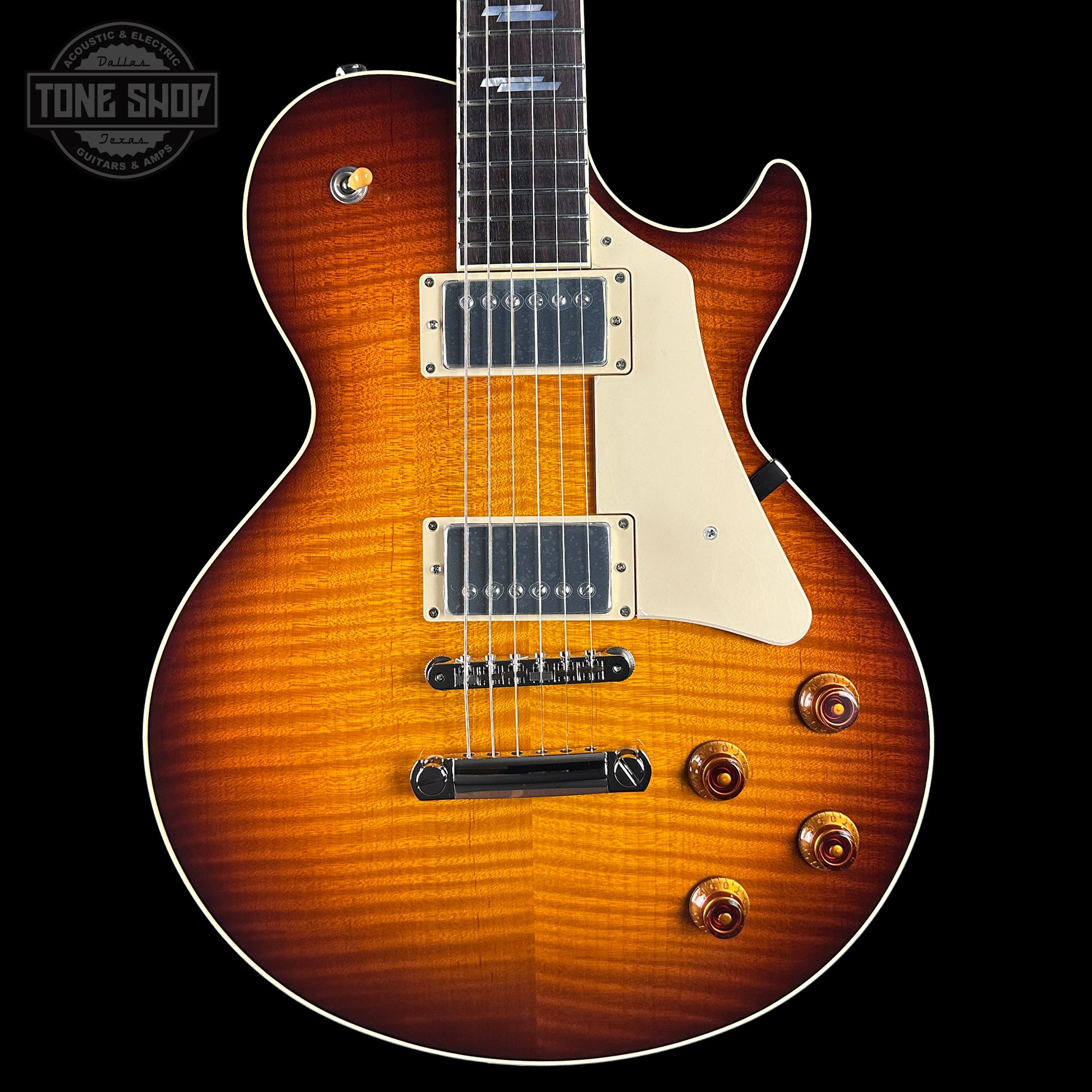 Electric guitar with a sunburst finish on a black background, featuring the Tone Shop logo.