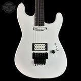 White electric guitar on a black background with 'Tone Shop' logo.