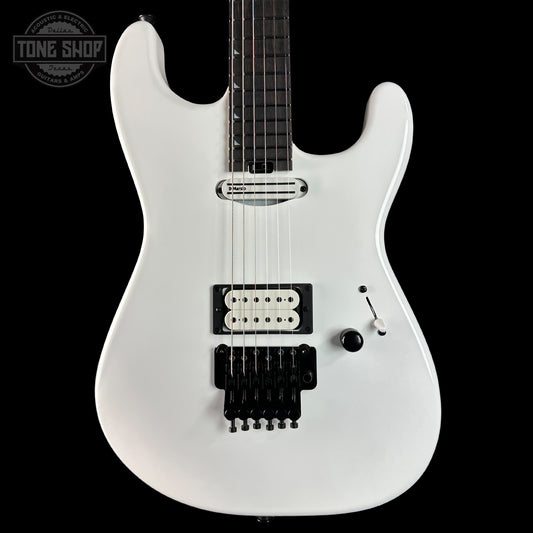 White electric guitar on a black background with 'Tone Shop' logo.
