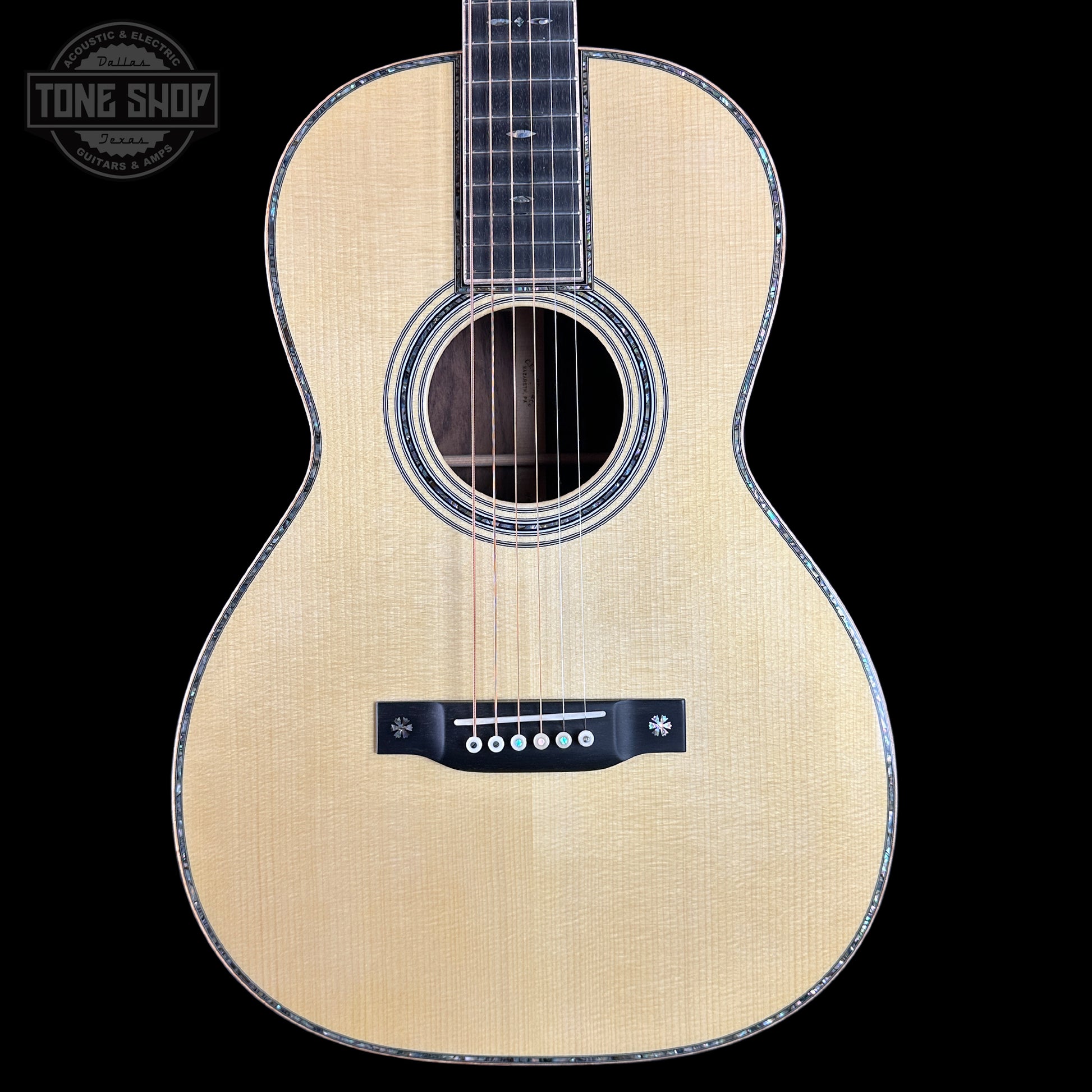 Front of Martin Custom Shop 00-12F 45 Style Adirondack/Wild Grain East Indian Rosewood.