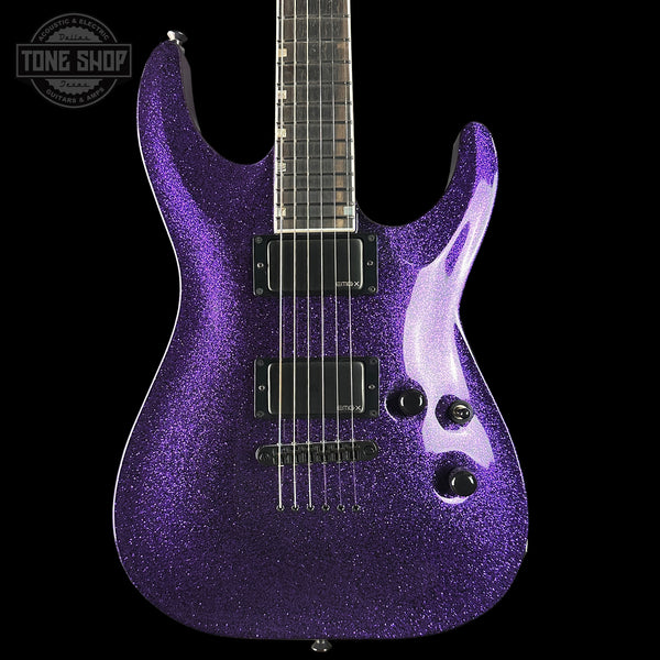 Purple glitter electric guitar on a black background with 'Tone Shop' logo.