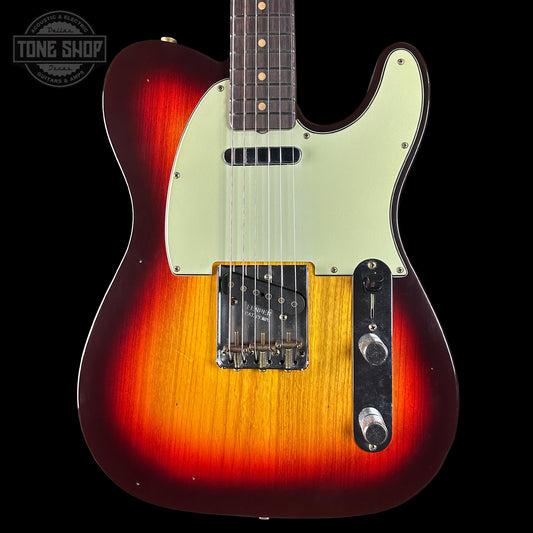 Electric guitar with a sunburst finish on a black background, featuring the Tone Shop logo.