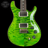 Green electric guitar with a black pickguard on a black background, featuring the Tone Shop logo.