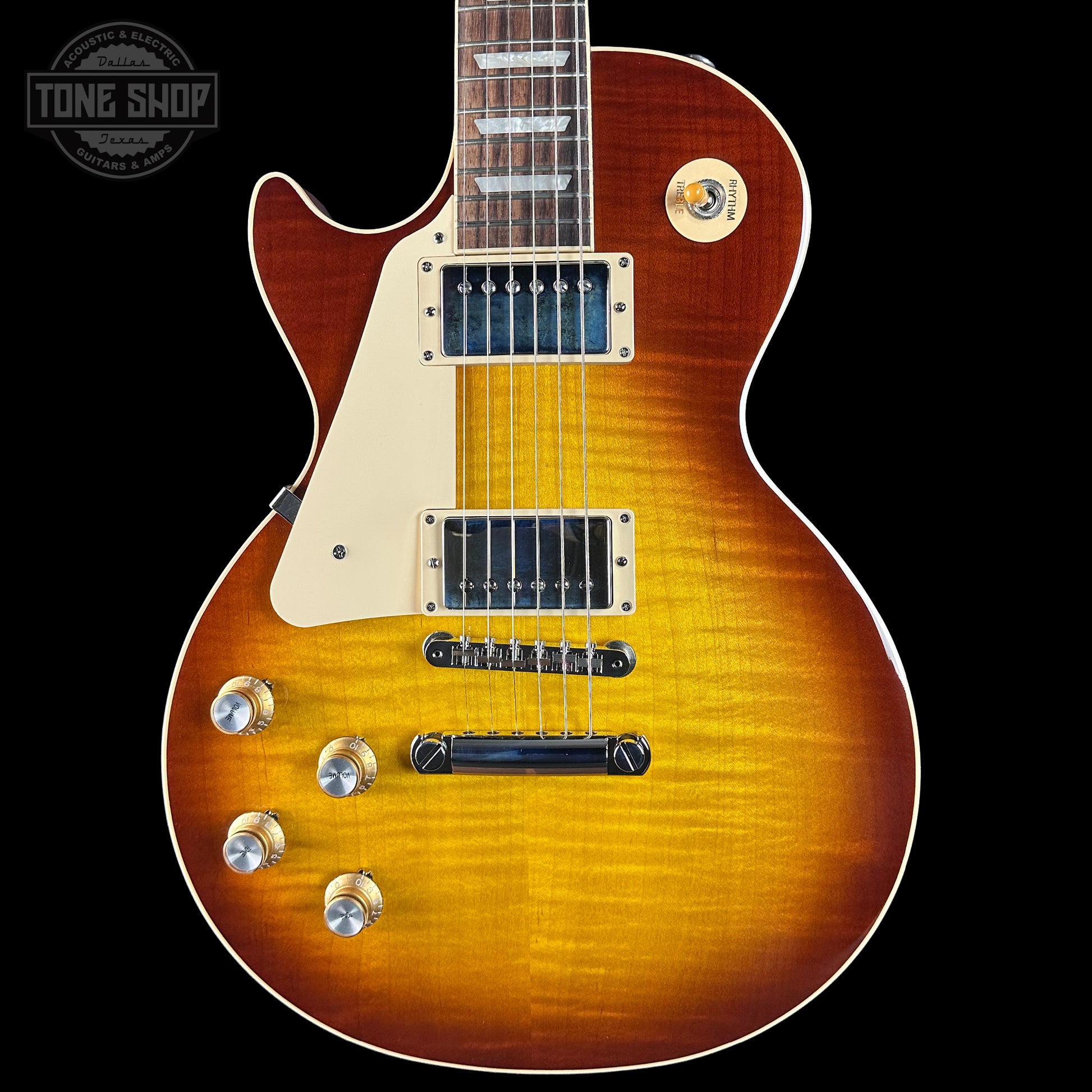 Electric guitar with a sunburst finish on a black background, featuring the Tone Shop logo.