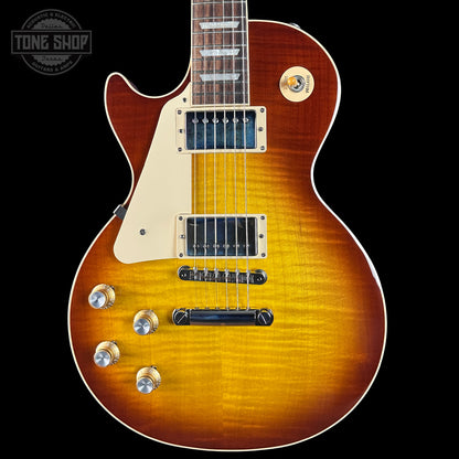 Electric guitar with a sunburst finish on a black background, featuring the Tone Shop logo.