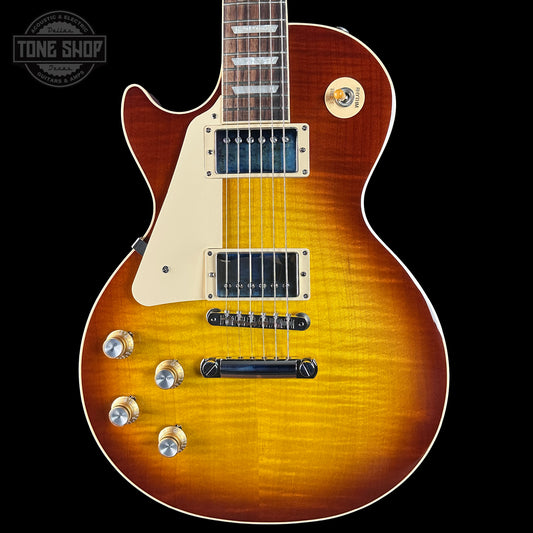Electric guitar with a sunburst finish on a black background, featuring the Tone Shop logo.