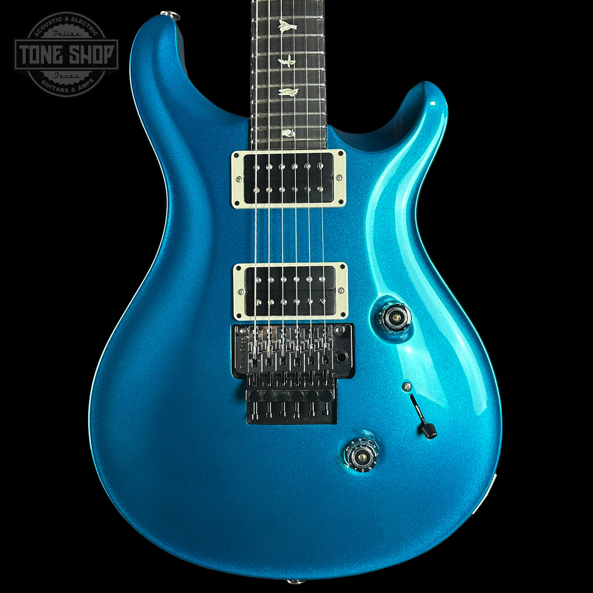 Blue electric guitar on a black background with 'Tone Shop' logo.