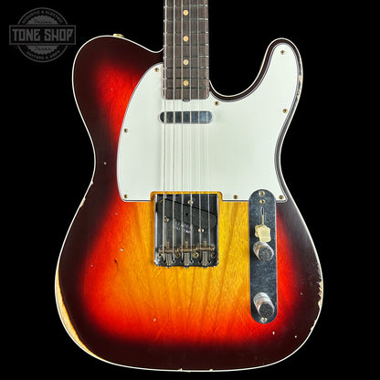 Electric guitar with a sunburst finish on a black background, featuring the Tone Shop logo.