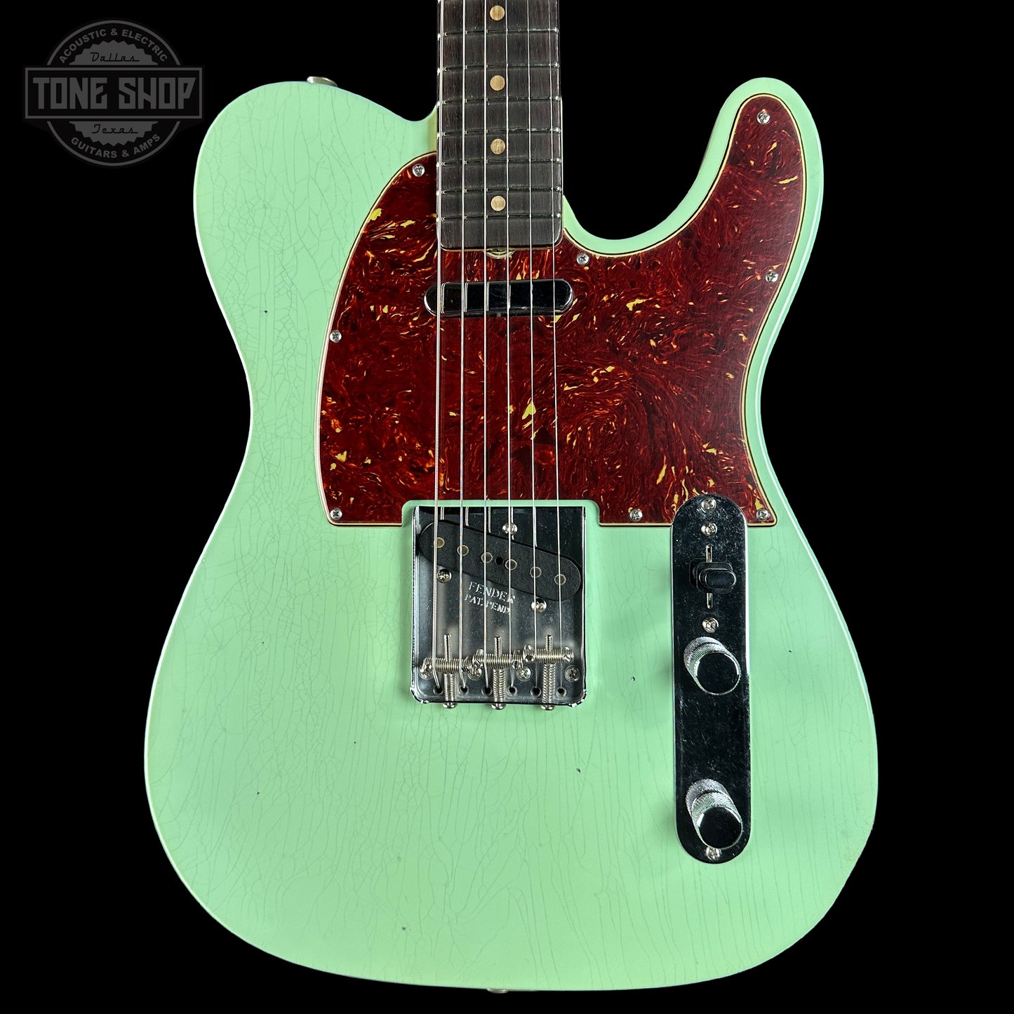 Front of Fender Custom Shop 1963 Telecaster Journeyman Relic Aged Surf Green.