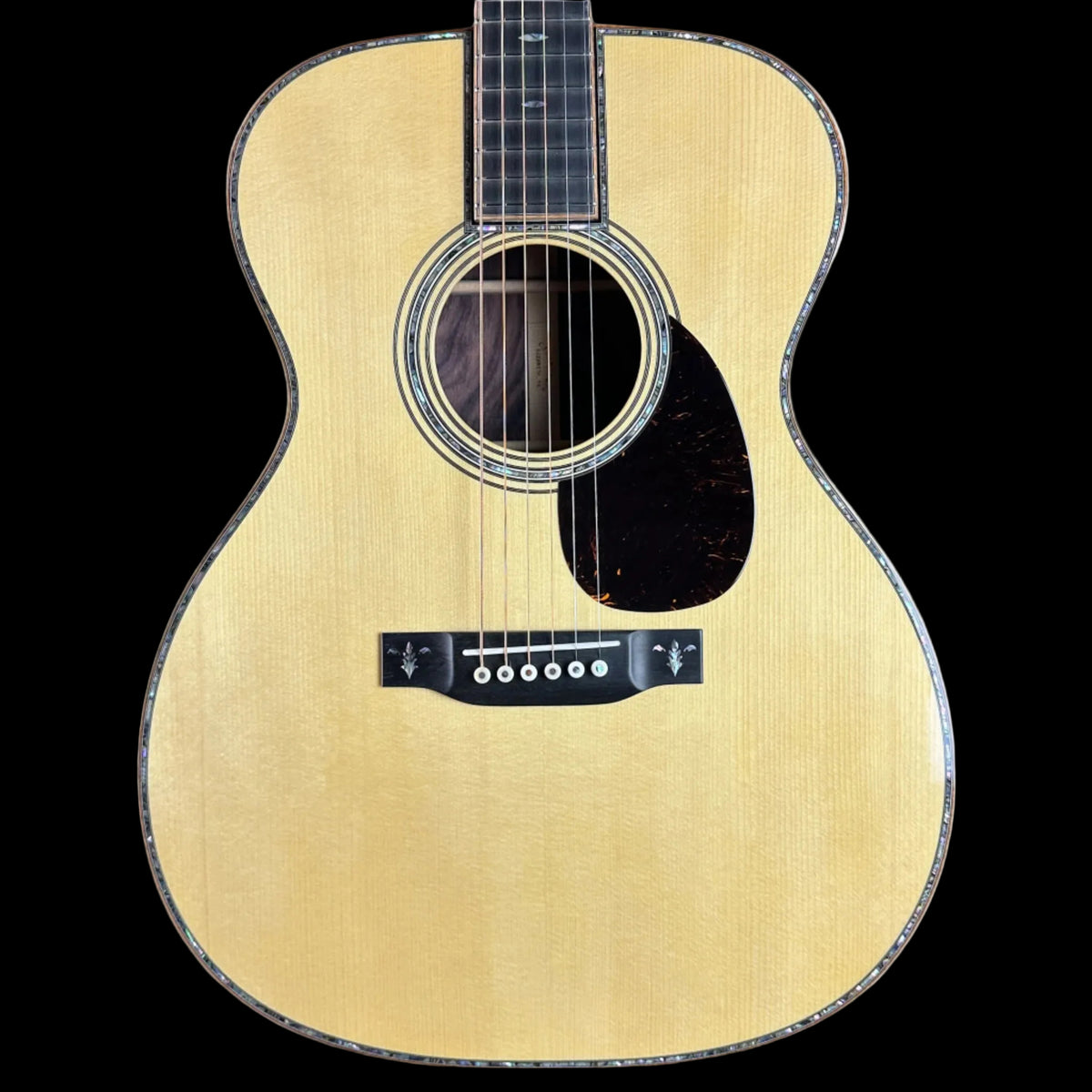 Front of Martin Custom Shop OM 42 Style Adirondack/Wild Grain East Indian Rosewood.