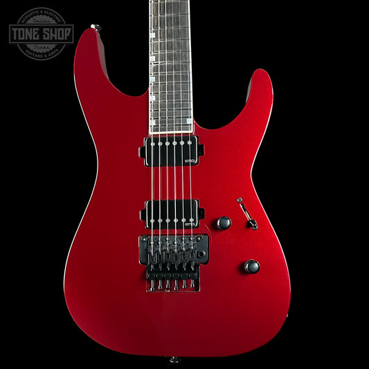 Red electric guitar on a black background with 'Tone Shop' logo.