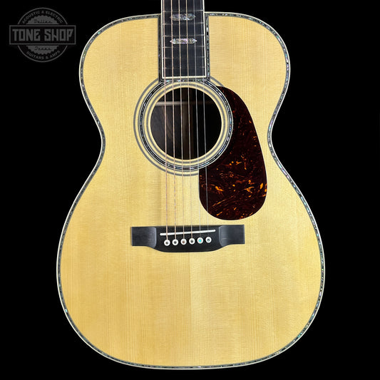 Acoustic guitar with a visible brand logo in the corner