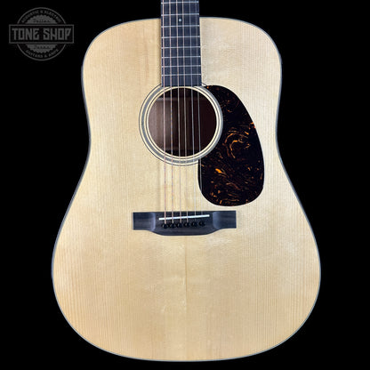 Acoustic guitar with a visible brand logo in the corner