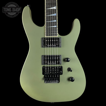 Green electric guitar on a black background with 'Tone Shop' logo.