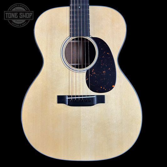 Acoustic guitar with a visible brand logo in the corner