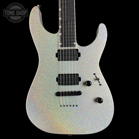 Electric guitar with a silver and black design on a black background