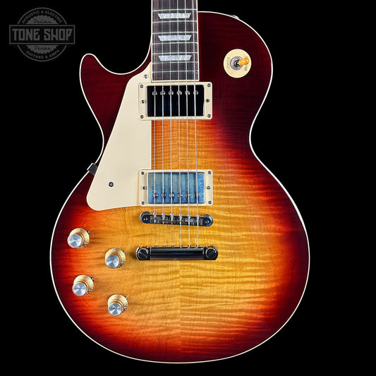 Electric guitar with a sunburst finish on a black background, featuring the Tone Shop logo.