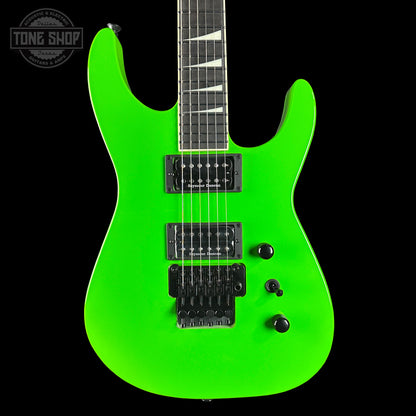 Green electric guitar on a black background with 'Tone Shop' logo.