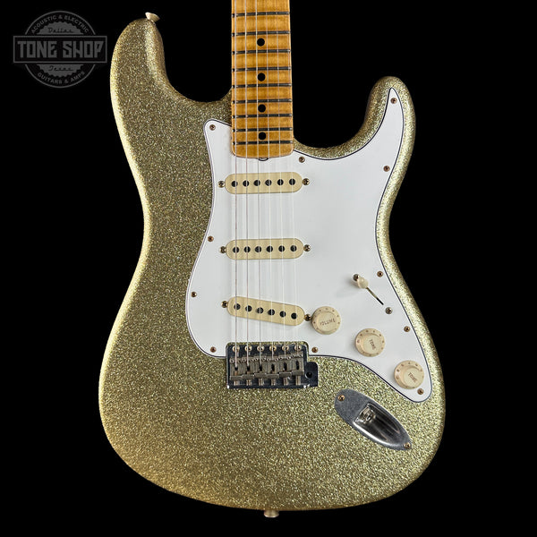Gold glitter electric guitar on a black background with 'Tone Shop' logo.