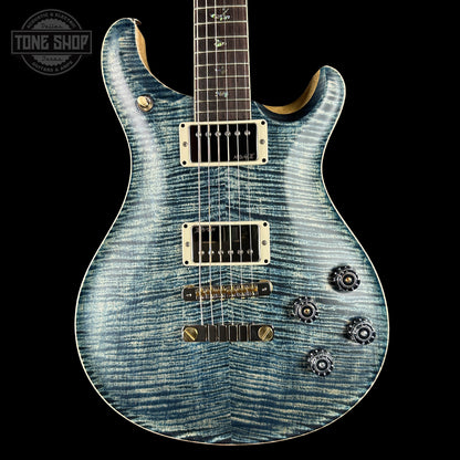 Blue electric guitar with a black background