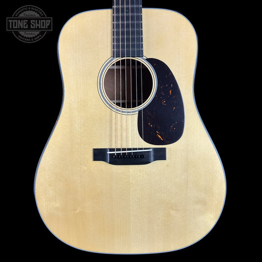 Acoustic guitar with a visible brand logo in the corner