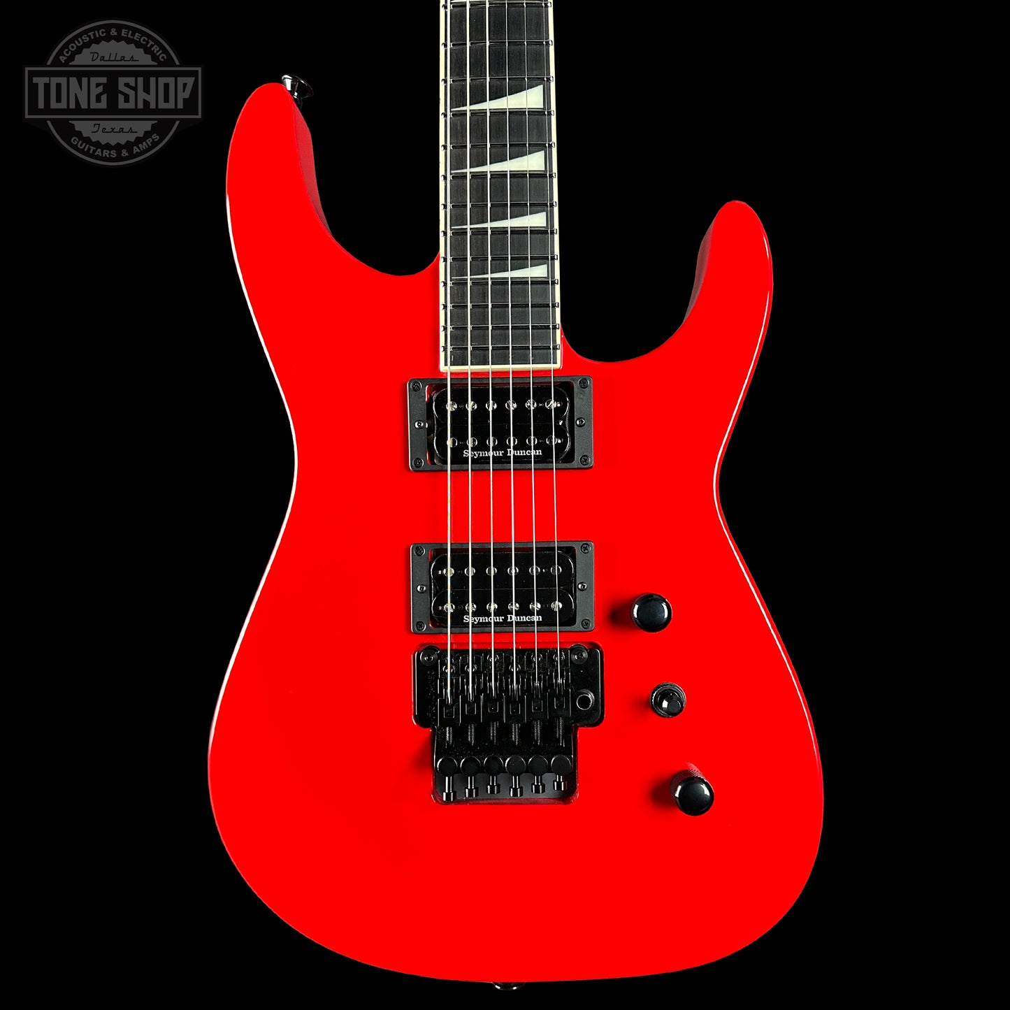 Red electric guitar on a black background with 'Tone Shop' logo.