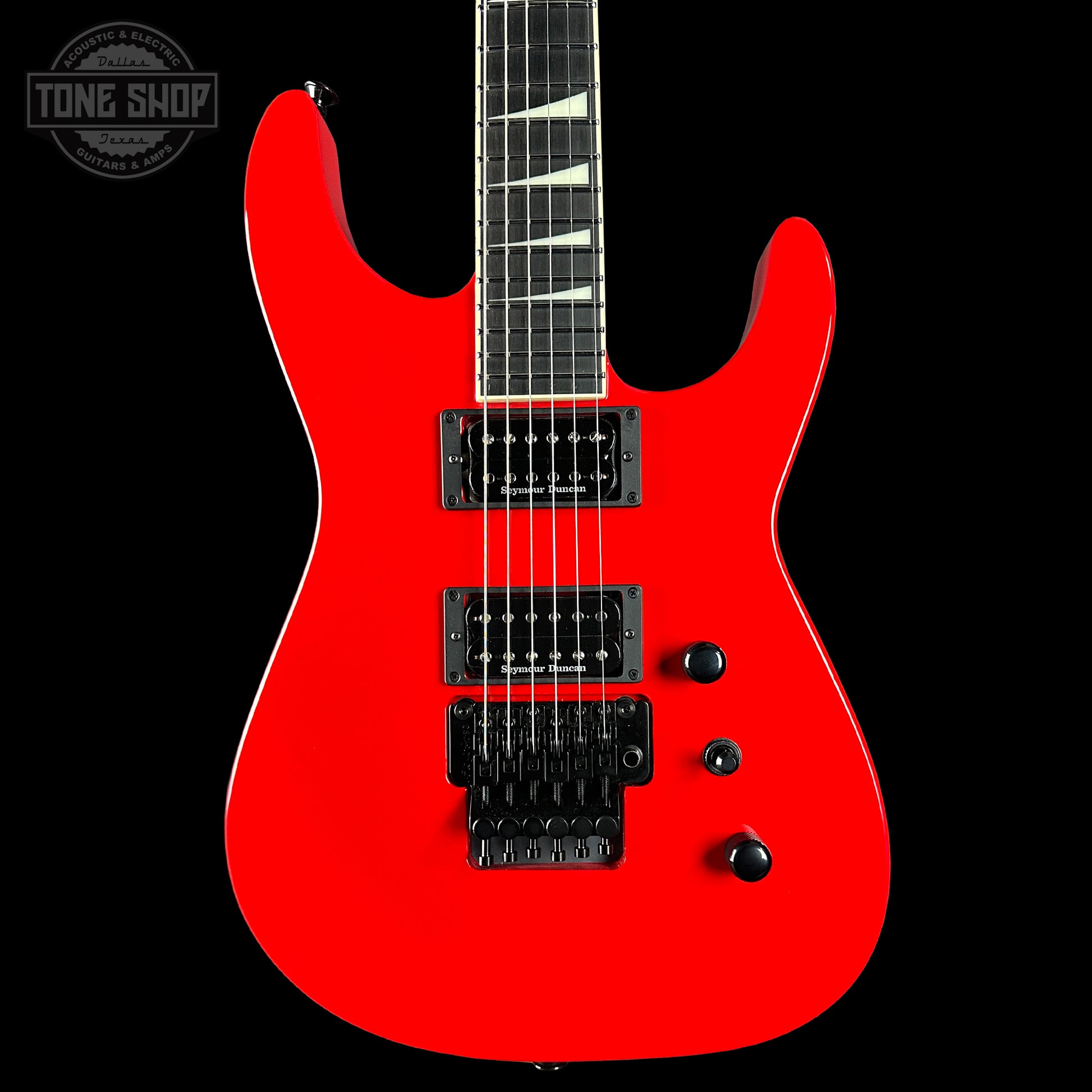 Red electric guitar on a black background with 'Tone Shop' logo.