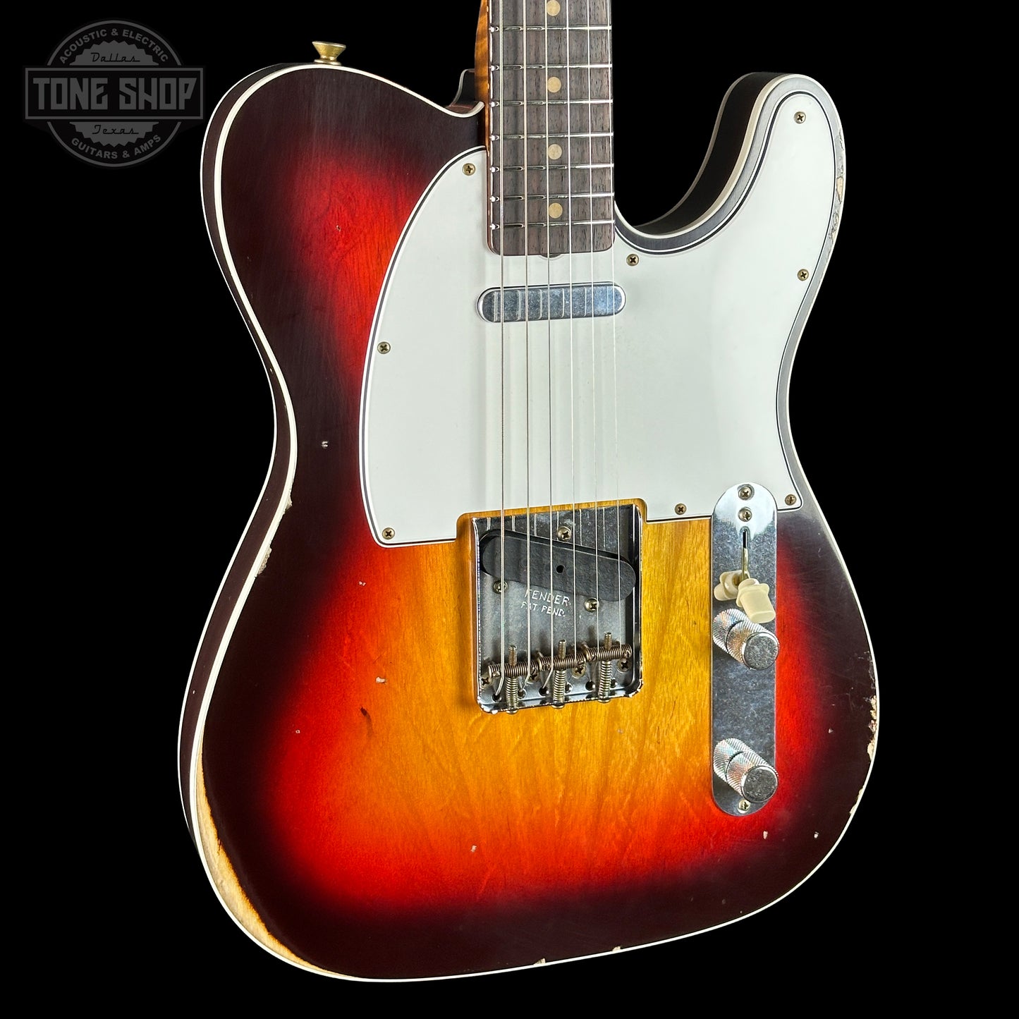Electric guitar with a sunburst finish on a black background, featuring the Tone Shop logo.