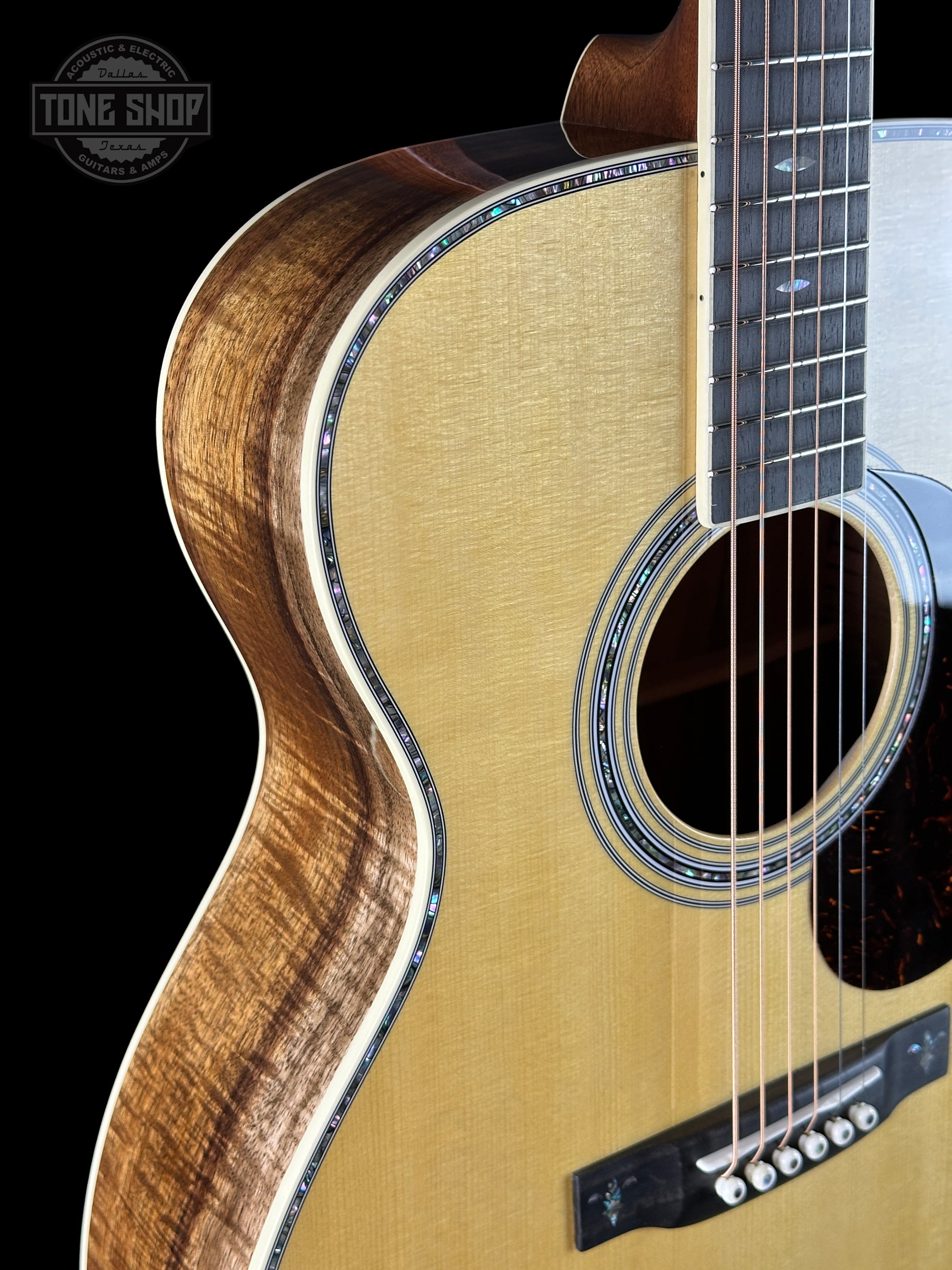 Front angle of Martin Custom Shop OM 41 Style Adirondack / Exceptional Broad Figure Koa.