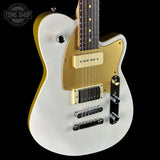 White electric guitar with gold accents on a black background, featuring 'Tone Shop' logo.