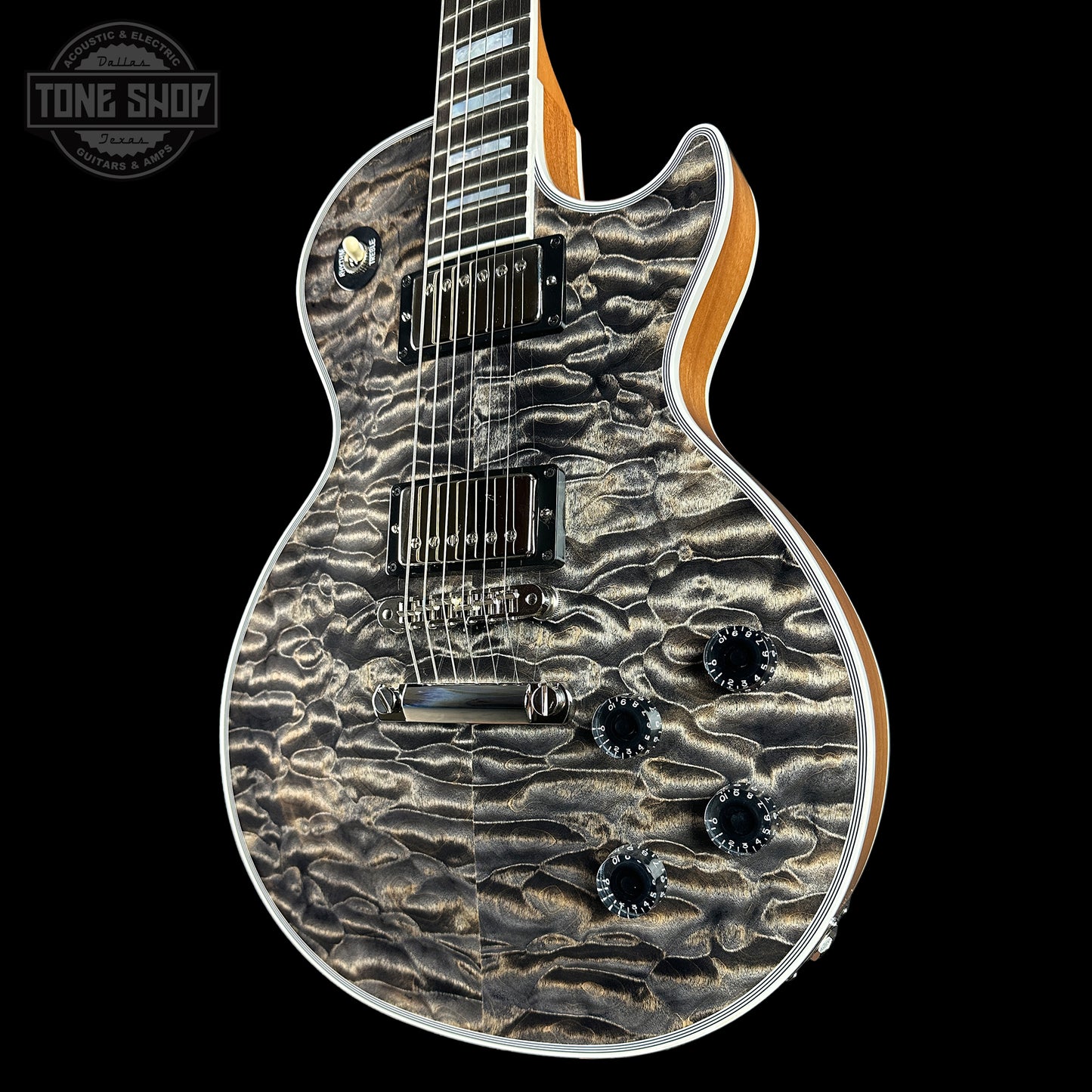 Front angle of Gibson Custom Shop TSG Anniversary Les Paul Custom Chambered 7A Quilt Cobra.