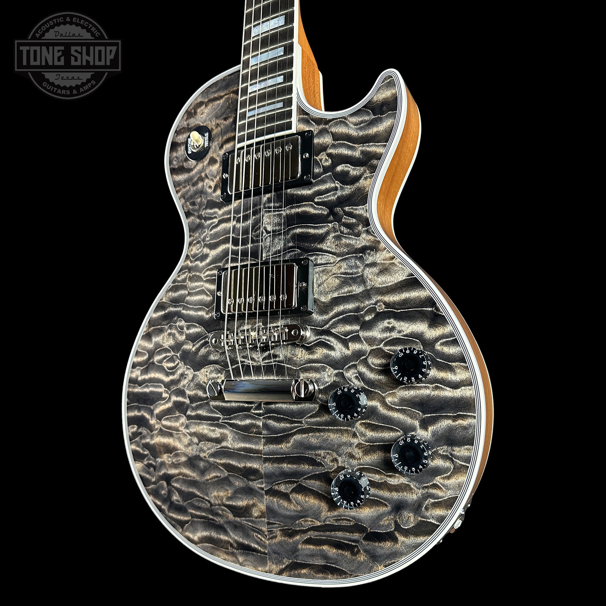 Front angle of Gibson Custom Shop TSG Anniversary Les Paul Custom Chambered 7A Quilt Cobra.
