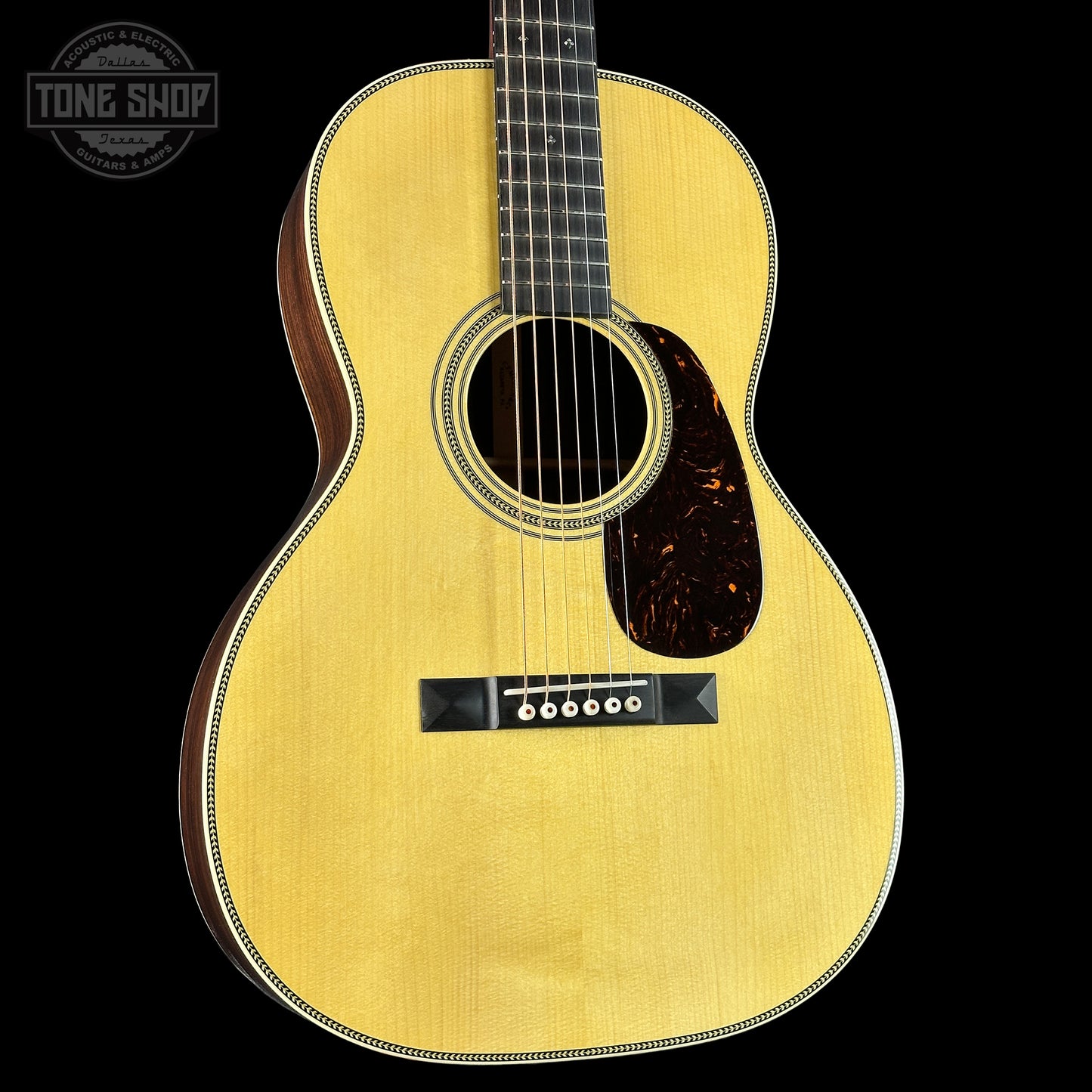 Front angle of Martin Custom Shop 00-12 Fret Wild Grain East Indian Rosewood.